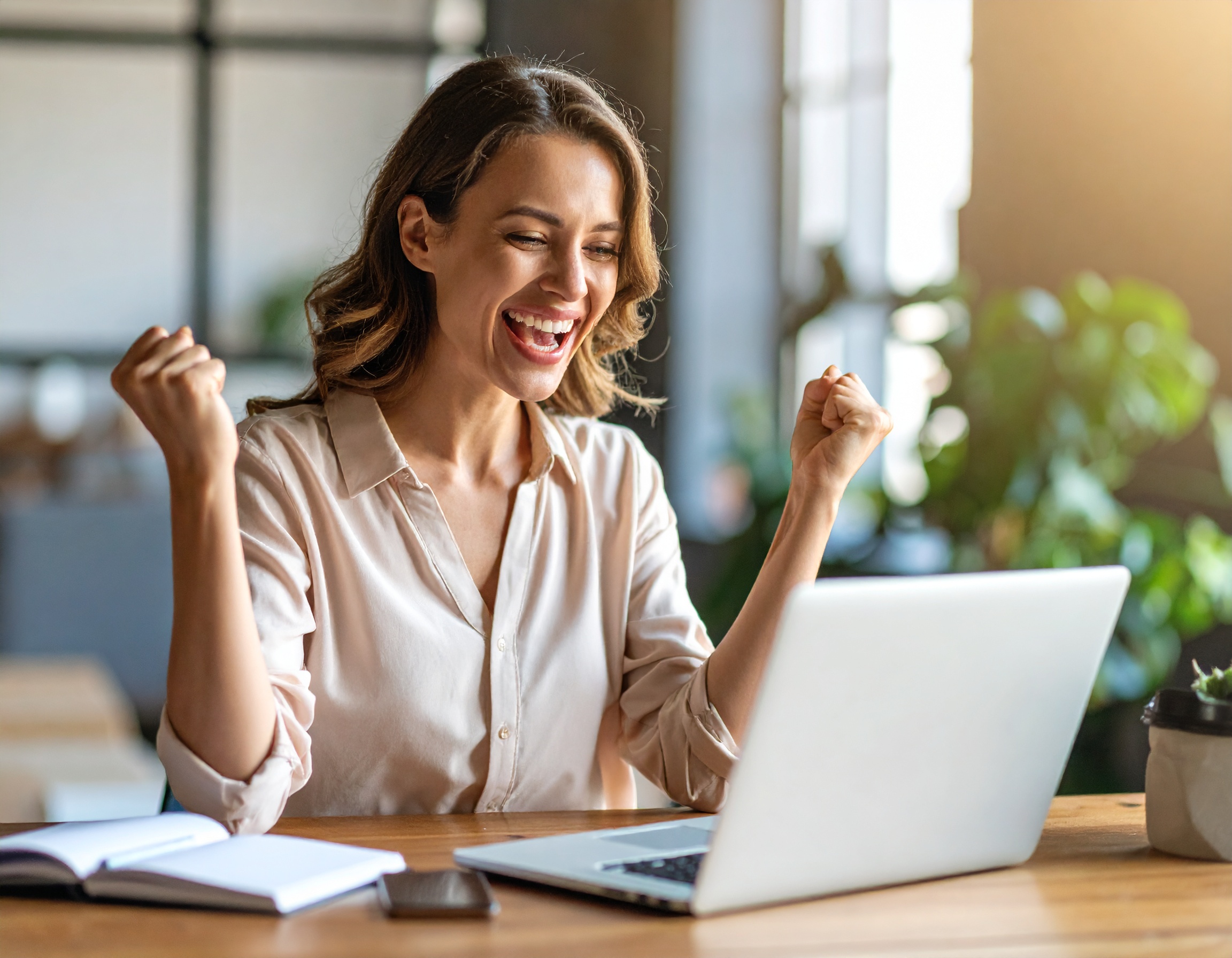 firefly_happy-woman-using-laptop-and-happy-she-received-a-good-email-message-378489 BEAM Automation | 5 Free Ways to Double Customer Engagement Using Your Existing CRM