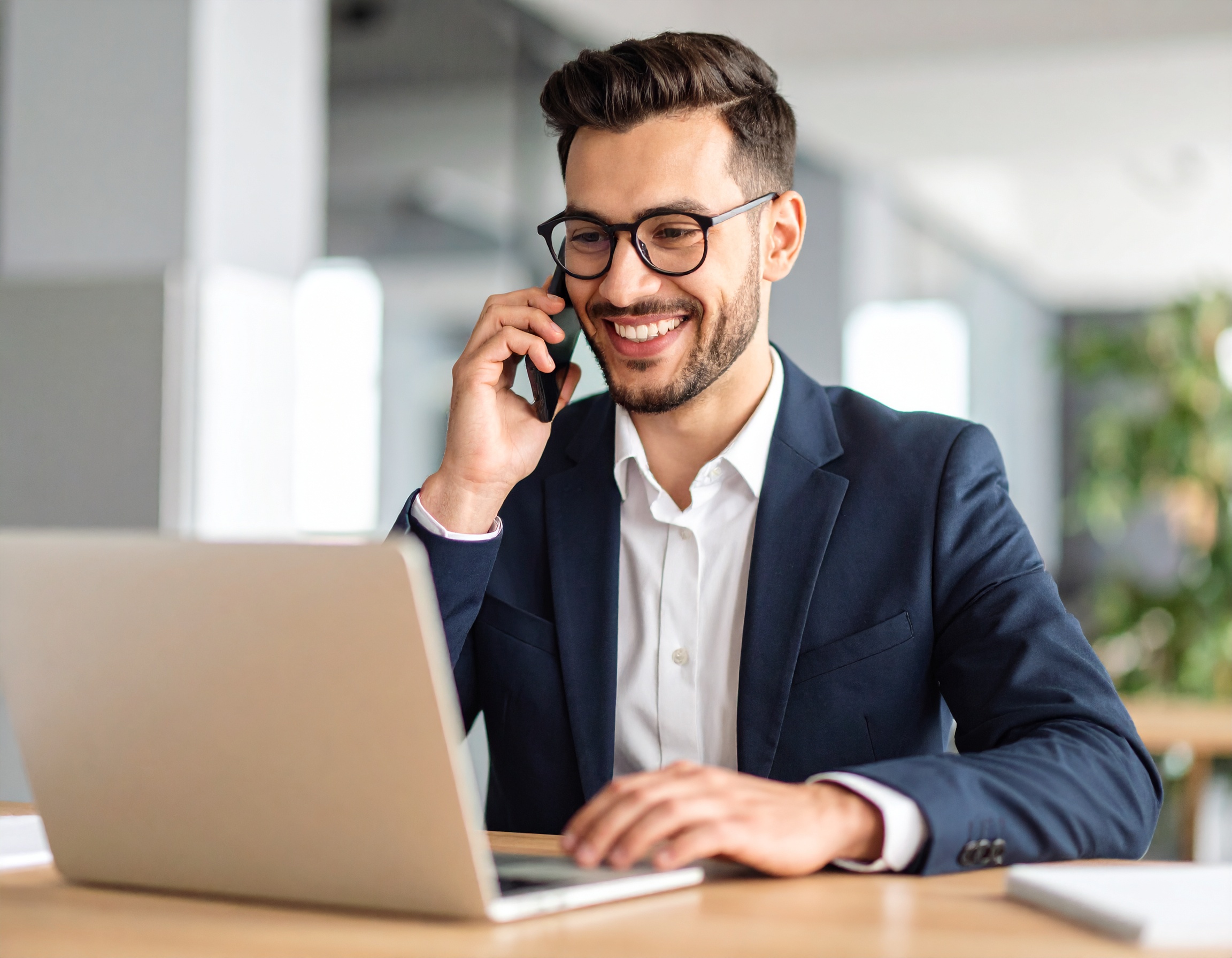 firefly_show-business-person-on-phone-at-best-with-computer-and-is-having-a-happy-conversatio-292374 BEAM Automation | 3 CRM Hacks to Drive Sales This Week Without New Leads