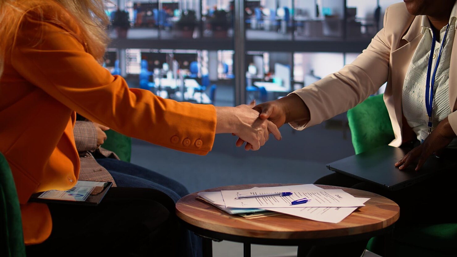 team-empowered-businesswomen-corporate-meeting-making-deal_482257-124008 Customer Acquisition vs Customer Retention Automation: Which Matters More? - BEAM Automation